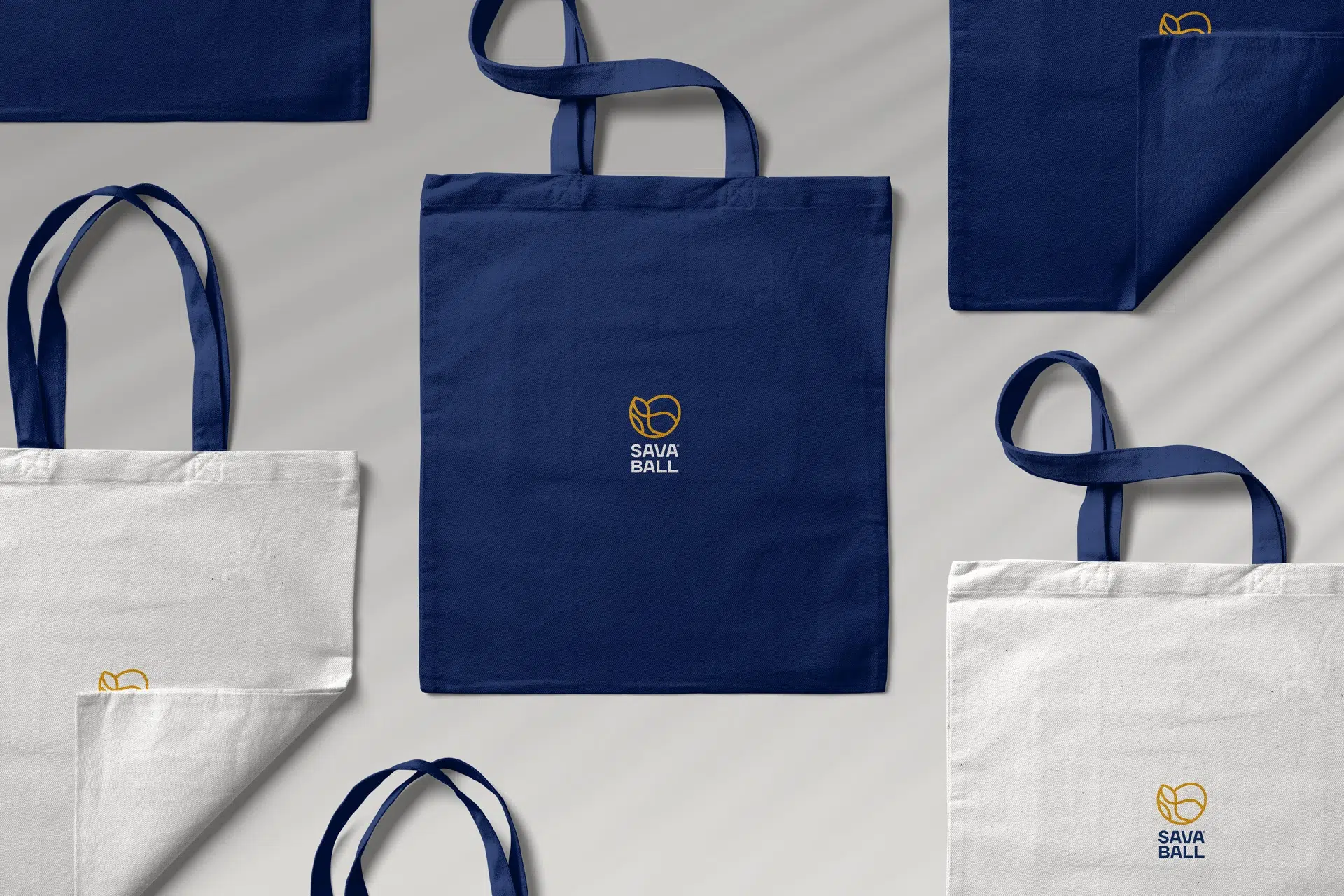 Visual identity for Savaball, featuring a swirling logo, elegant typography, and a rich palette of deep blue and yellow, reflecting Balkan culture in a Viennese ballroom setting.